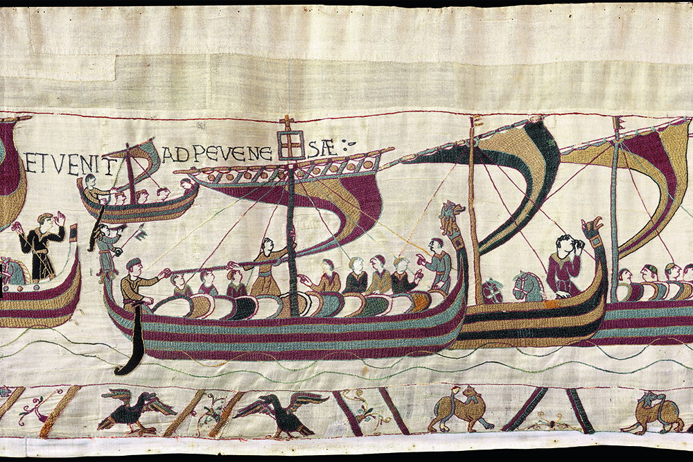 A detail of the Bayeux Tapestry depicting embroidered ships with crews of soldiers.