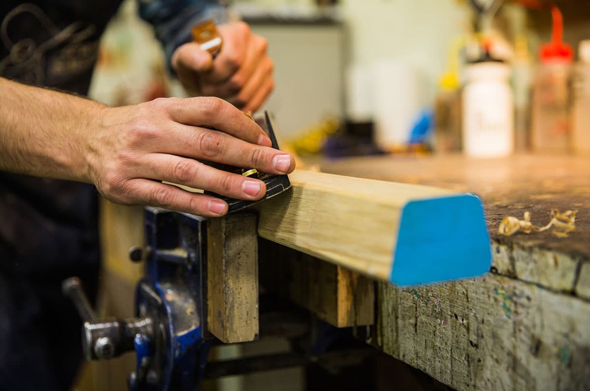 specialist furniture restorer restoring furniture in Plowden & Smith's London furniture restoration studio