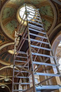 scaffolding tower with restorer working on grade i listed interior
