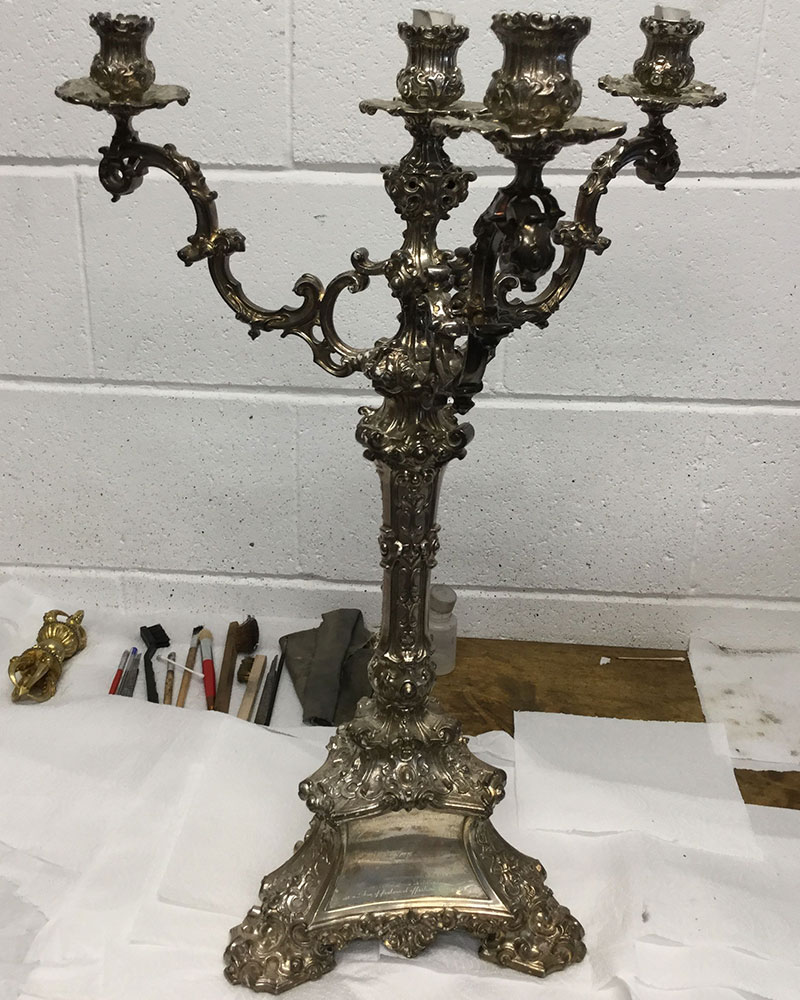 silver candelabrum before silver restoration and silver polishing treatment at Plowden & Smith